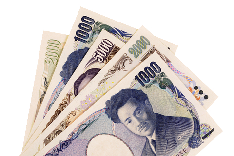 Billets de yen japonais empilés, représentant la monnaie officielle du Japon.